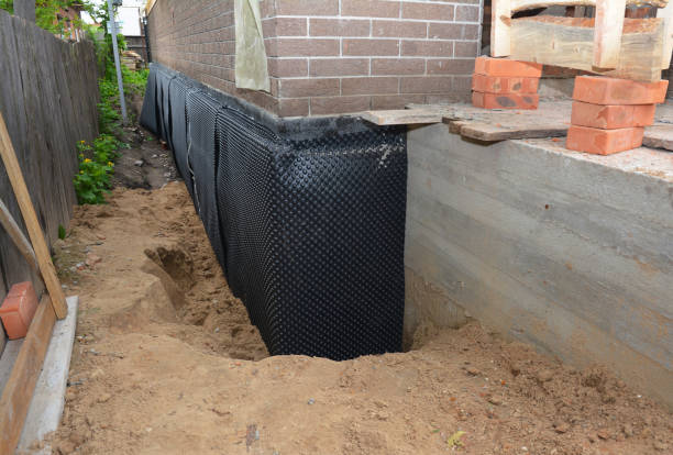 Happy homeowners after waterproofing job in Grand Island